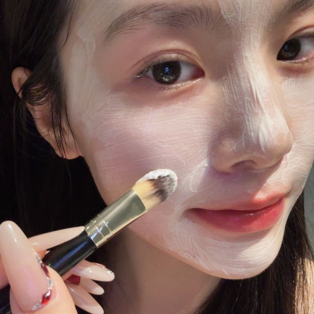 Woman following a natural skincare routine for radiant skin with The Skin Lustre.